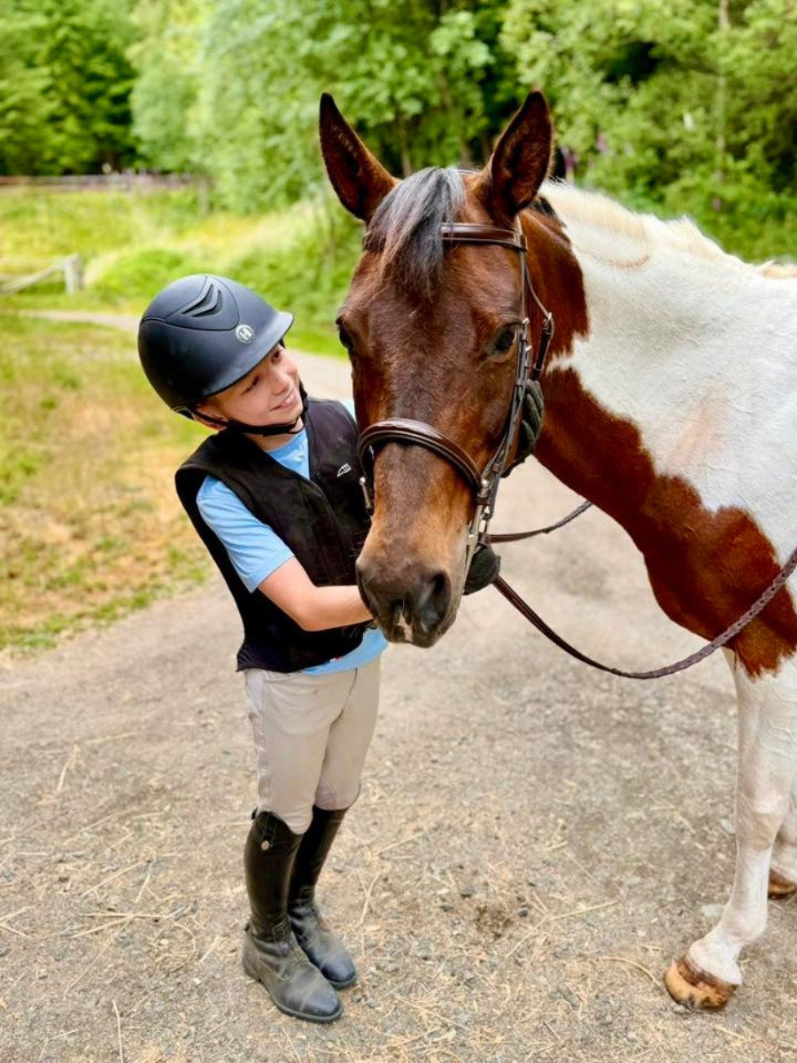 Pony club members learning horsemanship