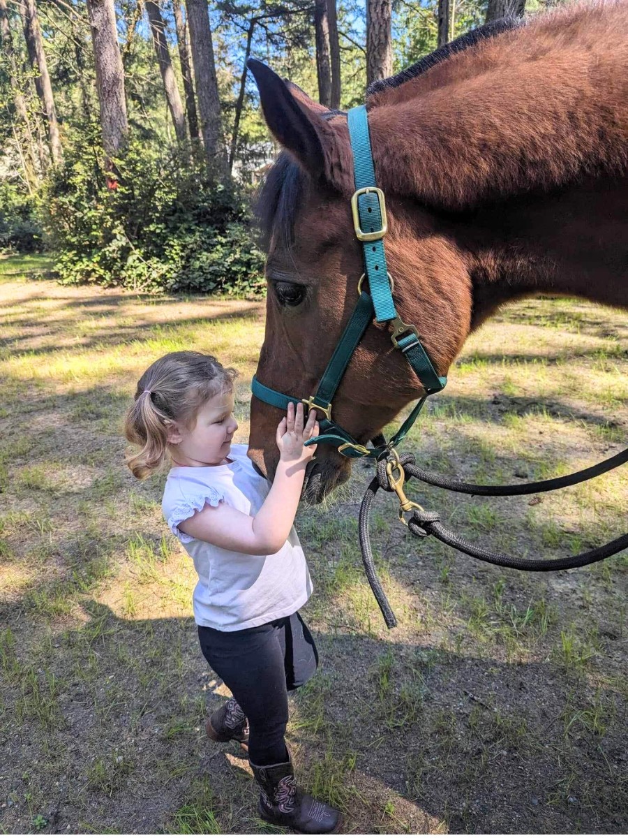 Young rider bonding with horse