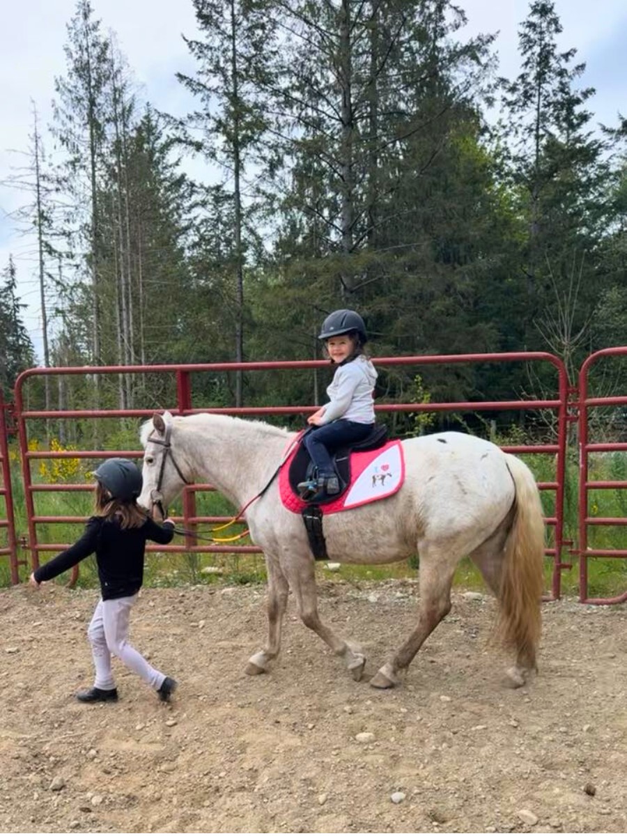 Two children with their pony